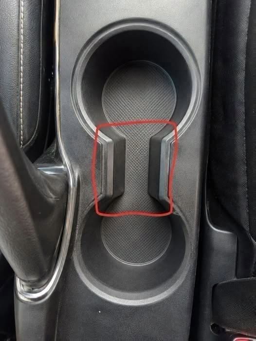 That Small Gap in Your Cup Holder Has a Clever Use